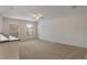 Bright bedroom features neutral carpet, two windows, and ceiling fan at 364 Fish Hawk Dr, Winter Haven, FL 33884