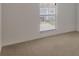 Upstairs bedroom with neutral carpet, a window, and neutral walls at 364 Fish Hawk Dr, Winter Haven, FL 33884