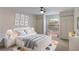 Bright bedroom with a ceiling fan, a cozy bed, 2 closets and matching furniture at 364 Fish Hawk Dr, Winter Haven, FL 33884