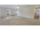 Bright bedroom features neutral carpet, two windows, and ceiling fan at 364 Fish Hawk Dr, Winter Haven, FL 33884