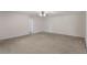 Large bonus room featuring neutral carpet and ceiling fan with direct access to a bedroom at 364 Fish Hawk Dr, Winter Haven, FL 33884