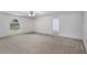Bonus room featuring neutral carpet and a window, providing ample natural light with direct access to bedroom at 364 Fish Hawk Dr, Winter Haven, FL 33884