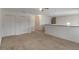 Upstairs Bonus Room with neutral carpet and access to bedrooms and a small balcony at 364 Fish Hawk Dr, Winter Haven, FL 33884