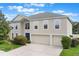 Charming two-story home with a spacious three-car garage and beautifully landscaped front yard at 364 Fish Hawk Dr, Winter Haven, FL 33884