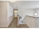 Upstairs hallway showcasing carpet and access to multiple rooms and the staircase at 364 Fish Hawk Dr, Winter Haven, FL 33884