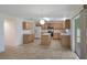 Open kitchen and breakfast nook with light wood cabinets, stainless appliances and natural light at 364 Fish Hawk Dr, Winter Haven, FL 33884