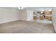 Open living area flowing into kitchen, featuring tile flooring and modern appliances at 364 Fish Hawk Dr, Winter Haven, FL 33884