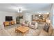 Open-concept living room with modern furnishings, lots of natural light and view to the kitchen at 364 Fish Hawk Dr, Winter Haven, FL 33884