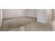 Large living room featuring neutral carpet, and a tiled border with access to other parts of the home at 364 Fish Hawk Dr, Winter Haven, FL 33884