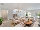 Elegant living room featuring neutral tones, a round coffee table and a flood of natural light at 364 Fish Hawk Dr, Winter Haven, FL 33884