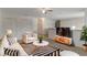 Cozy living room featuring modern decor, a comfortable sofa, and stylish accents at 364 Fish Hawk Dr, Winter Haven, FL 33884