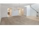 Spacious living room showcasing neutral carpet, tiled entry, and a chandelier adding elegance to the area at 364 Fish Hawk Dr, Winter Haven, FL 33884