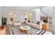 Bright living room featuring modern furnishings, sleek chandeliers and a stylish black and white rug at 364 Fish Hawk Dr, Winter Haven, FL 33884