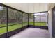 Screened-in patio offering outdoor living space with views of the backyard at 364 Fish Hawk Dr, Winter Haven, FL 33884