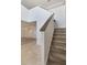 Staircase featuring carpeted stairs and tile, with a chandelier and glimpses of the open living area at 364 Fish Hawk Dr, Winter Haven, FL 33884