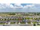 Beautiful aerial view of a neighborhood featuring well-maintained homes and landscaping at 371 Pinecrest Loop, Davenport, FL 33837