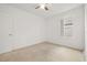 Cozy bedroom with carpet, ceiling fan, and a bright window at 371 Pinecrest Loop, Davenport, FL 33837