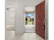 View from the entryway showcasing neutral tile, leading into a bright, open interior at 371 Pinecrest Loop, Davenport, FL 33837