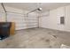 Spacious garage with a large door and concrete flooring at 371 Pinecrest Loop, Davenport, FL 33837