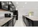 Updated kitchen featuring granite countertops, stainless steel appliances, and tile flooring at 371 Pinecrest Loop, Davenport, FL 33837