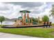 Community playground with slides and swings at 371 Pinecrest Loop, Davenport, FL 33837
