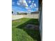 Large backyard with a well-maintained lawn and a privacy fence, ideal for outdoor activities at 3839 Marbella Way, Davenport, FL 33897
