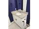 Charming bathroom with granite countertop and white cabinetry, providing a stylish and functional space at 3839 Marbella Way, Davenport, FL 33897