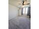 Neutral-toned bedroom with carpeting, a ceiling fan, and natural light from windows at 3839 Marbella Way, Davenport, FL 33897