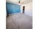 Comfortable bedroom with a ceiling fan, carpeted floor, and a view of the ensuite bathroom at 3839 Marbella Way, Davenport, FL 33897