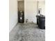 Garage with water heater and garbage can at 3839 Marbella Way, Davenport, FL 33897