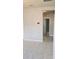 Hallway with neutral-colored walls and tile flooring leading to other rooms at 3839 Marbella Way, Davenport, FL 33897