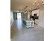 Spacious kitchen with granite island and stainless appliances, connecting to the living area at 3839 Marbella Way, Davenport, FL 33897