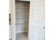 A well-organized pantry with ample storage shelves and tiled floor at 3839 Marbella Way, Davenport, FL 33897