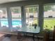 Tranquil backyard view overlooking a sparkling swimming pool and a well-maintained grassy lawn at 421 Bridle Path, Casselberry, FL 32707