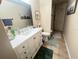 Bathroom with a white vanity, tile floors, and neutral decor at 421 Bridle Path, Casselberry, FL 32707