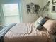 Bedroom featuring natural light, a cozy bed, and personalized decor at 421 Bridle Path, Casselberry, FL 32707