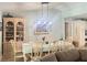 Bright dining area with a table, seating for eight, and decorative furnishings at 421 Bridle Path, Casselberry, FL 32707