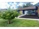 Well-maintained front exterior with mature landscaping and inviting walkway to the entrance at 421 Bridle Path, Casselberry, FL 32707