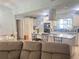Bright kitchen with white cabinetry, a center island, stainless steel appliances, and wood flooring at 421 Bridle Path, Casselberry, FL 32707