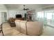 Inviting living room with a stone fireplace, ceiling fan, and sliding glass doors leading to an outdoor area at 421 Bridle Path, Casselberry, FL 32707