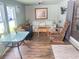 Charming living room with hardwood floors, floral sofa, and vintage furniture offering a relaxing atmosphere at 421 Bridle Path, Casselberry, FL 32707