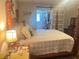 Comfortable main bedroom with four-poster bed and walk-in closet at 421 Bridle Path, Casselberry, FL 32707