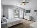 Bright bedroom with natural light, neutral tones, and modern decor creates a serene and inviting space at 447 Hammerstone Ave, Haines City, FL 33844