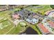 Breathtaking aerial view of the community amenities, golf course, pool, and clubhouse at 4928 Cortland Dr, Davenport, FL 33837