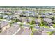Gorgeous aerial view of homes with lake, showing well-maintained landscaping, and serene atmosphere at 4928 Cortland Dr, Davenport, FL 33837