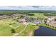 Expansive aerial view of the community, showcasing the golf course, and lush green surroundings at 4928 Cortland Dr, Davenport, FL 33837