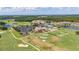 Sweeping aerial view of the community, highlighting the golf course, swimming pool, and clubhouse at 4928 Cortland Dr, Davenport, FL 33837