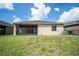 Large backyard with a screened lanai, green grass, and no rear neighbors offering privacy at 4928 Cortland Dr, Davenport, FL 33837