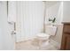 Bright bathroom with decorative shower curtain, toilet and granite counter vanity at 4928 Cortland Dr, Davenport, FL 33837