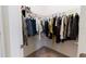 Walk-in closet with plentiful hanging space and organized with colorful garments at 4928 Cortland Dr, Davenport, FL 33837